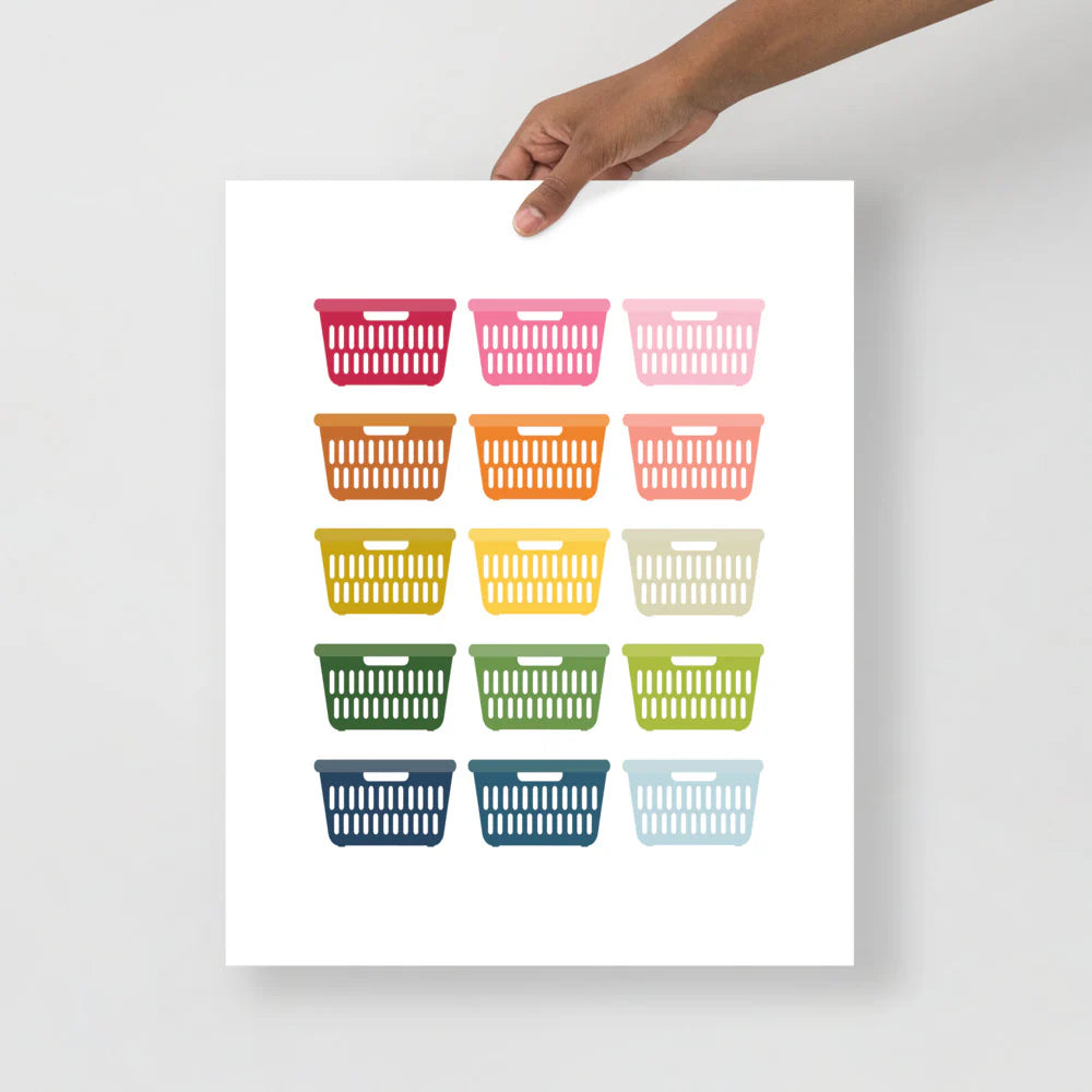 laundry room art print with a white background and grid of colorful clip art of laundry baskets in ombre rainbow colors ranging from pinks to blues