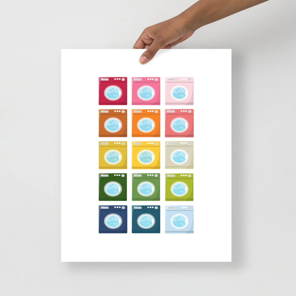 laundry room art print with a white background and grid of colorful clip art of washing machines in ombre rainbow colors ranging from pinks to blues