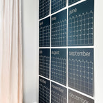 large erasable navy blue wall calendar hanging on wall from Kaleidoscope Living