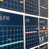 close up view of large erasable navy blue wall calendar from Kaleidoscope Living