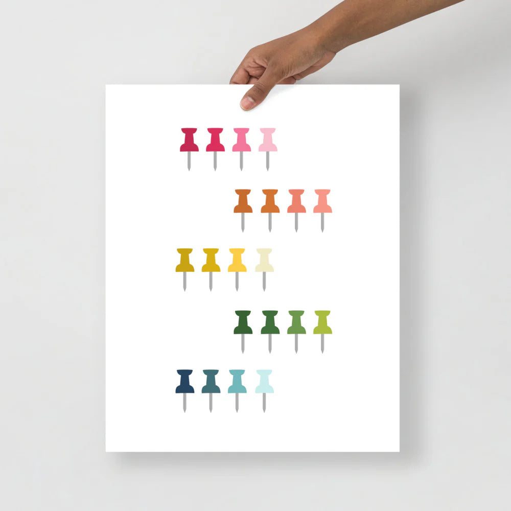 office art print with a white background and grid of colorful clip art of push pins in ombre rainbow colors ranging from pinks to blues