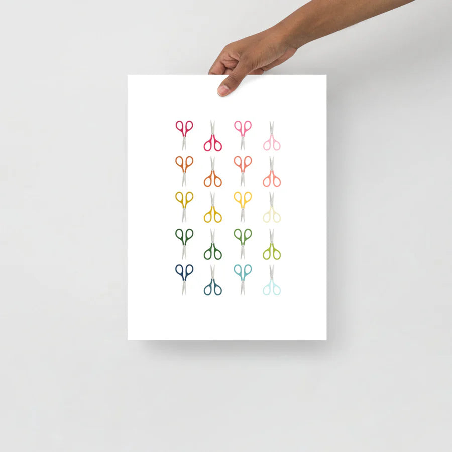 office art print with a white background and grid of colorful clip art of scissors in ombre rainbow colors ranging from pinks to blues