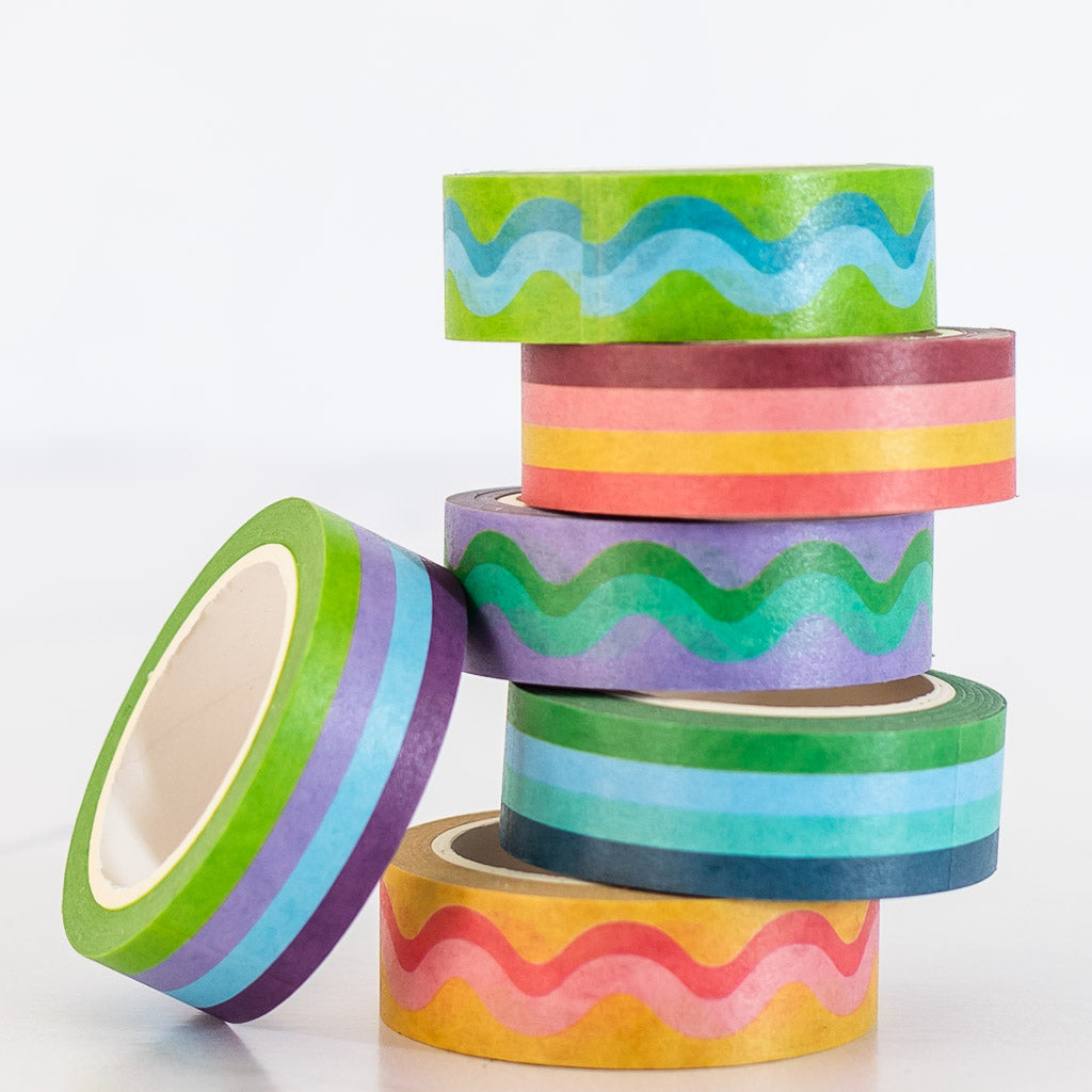 colorful striped and squiggled lines washi tape stacked in a pile