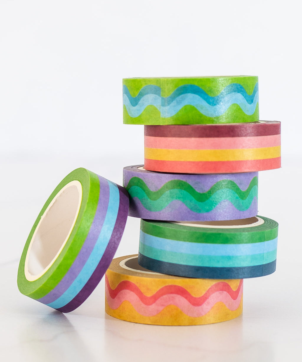 image of colorful striped and squiggle washi tape stacked in a pile