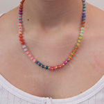 Multicolored statement necklace with round beads, neon cord and gold clasp by Kaleidoscope Living