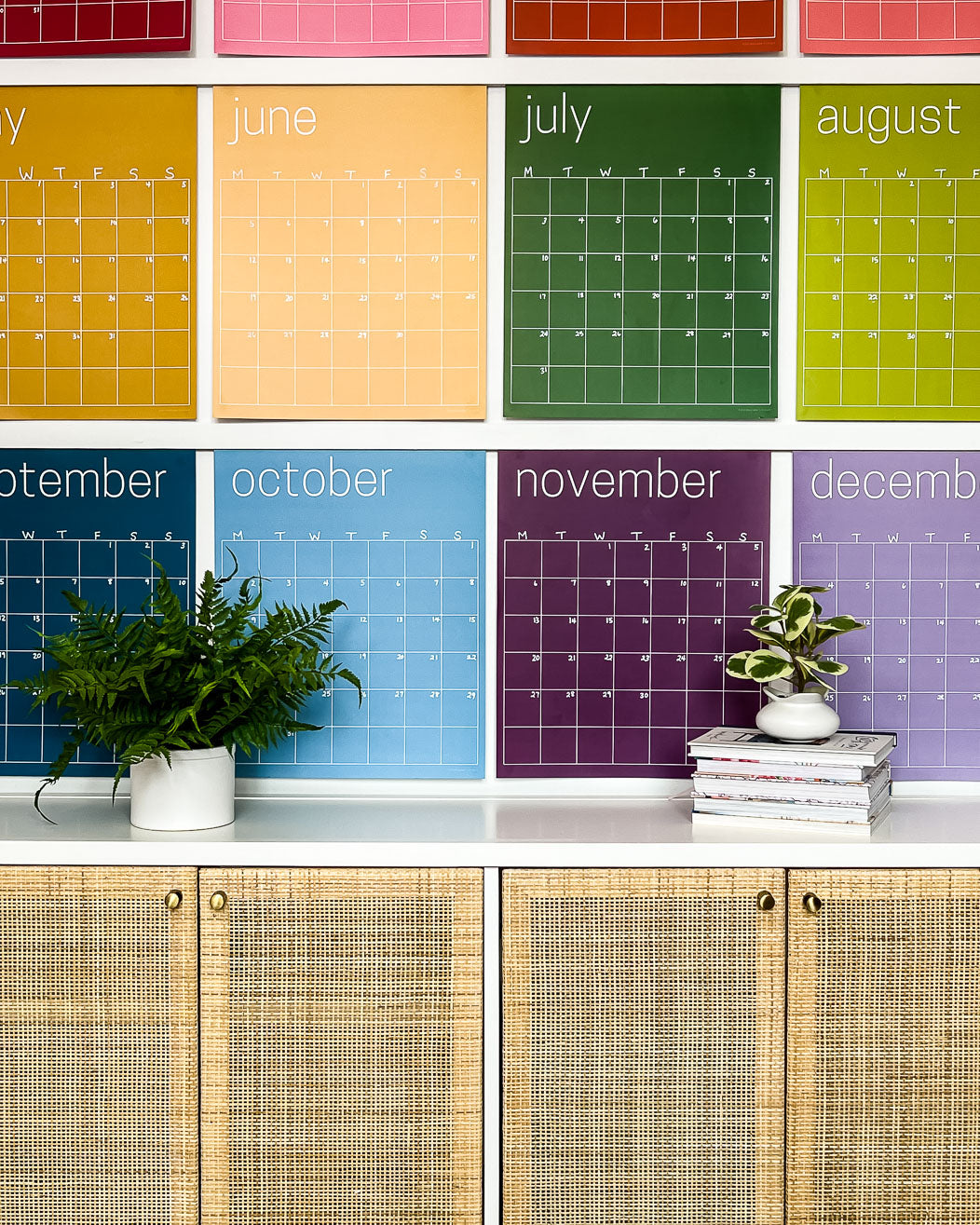 Close up of the large undated and reusable wall calendar in colorful rainbow hues from Kaleidoscope Living.