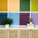 Close up of the large undated and reusable wall calendar in colorful rainbow hues from Kaleidoscope Living.