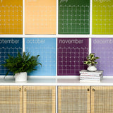 Close up of the large undated and reusable wall calendar in colorful rainbow hues from Kaleidoscope Living.