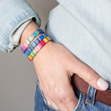 Close up of three colorful resin bracelets by kaleidoscope Living.