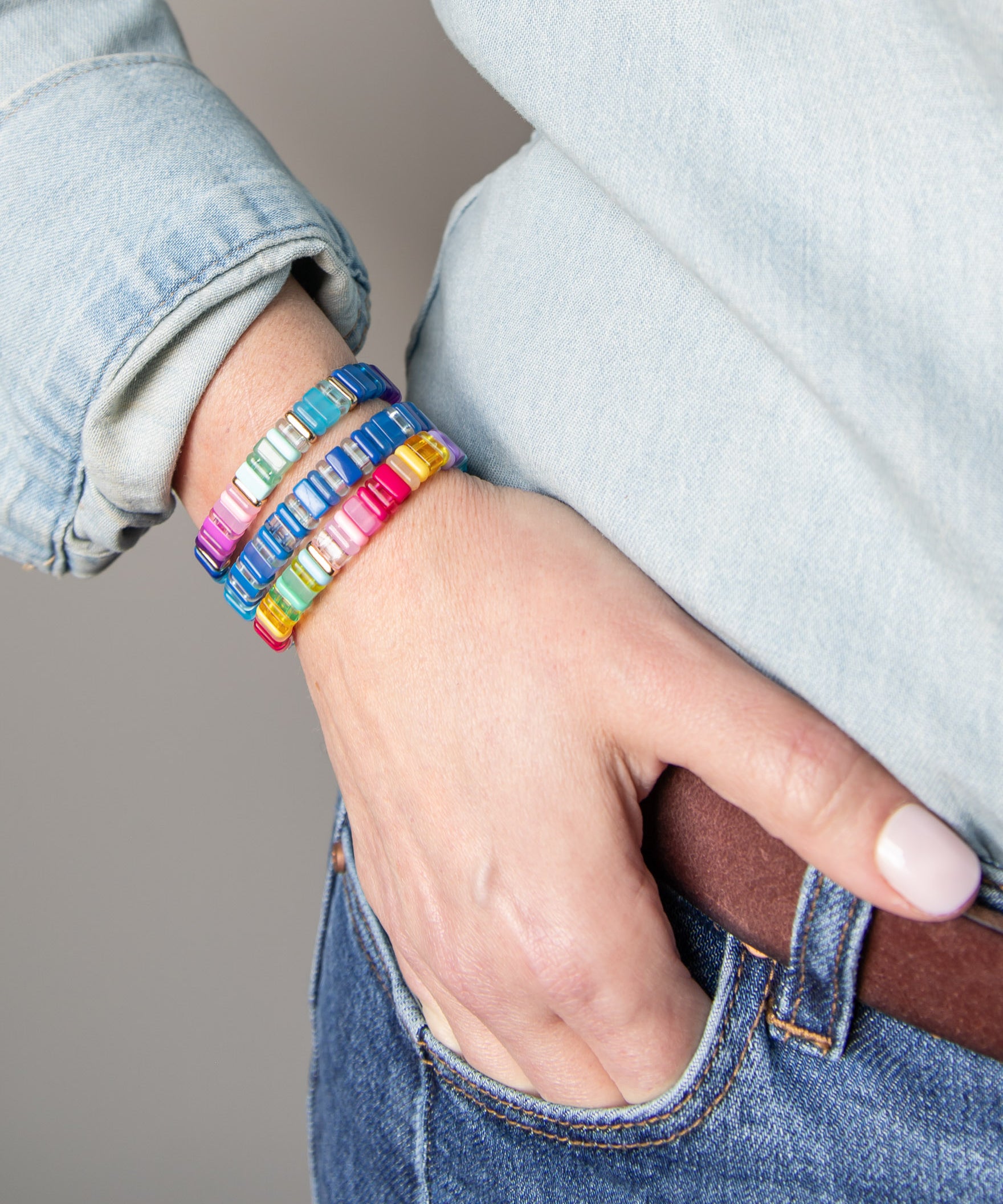 Close up of three colorful resin bracelets by kaleidoscope Living.