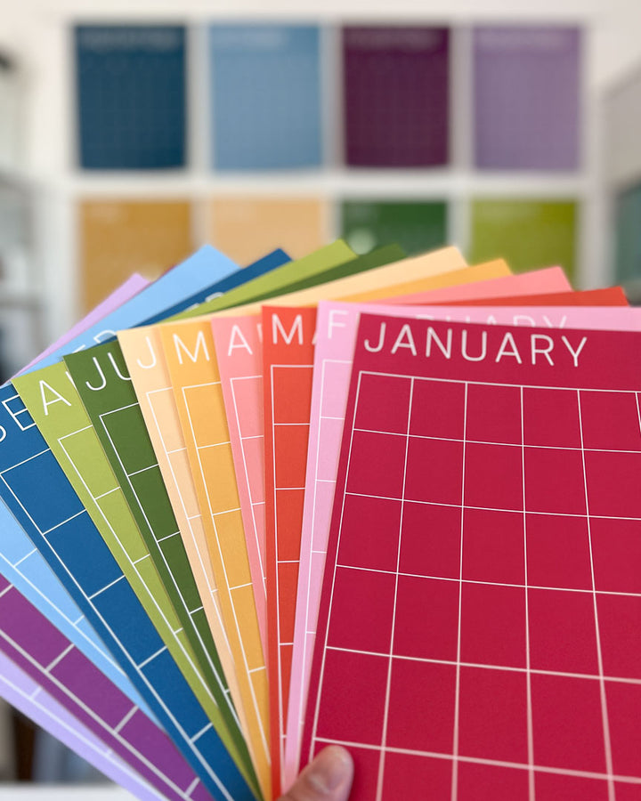 letter-size monthly wall calendar in rainbow colors by Kaleidoscope Living