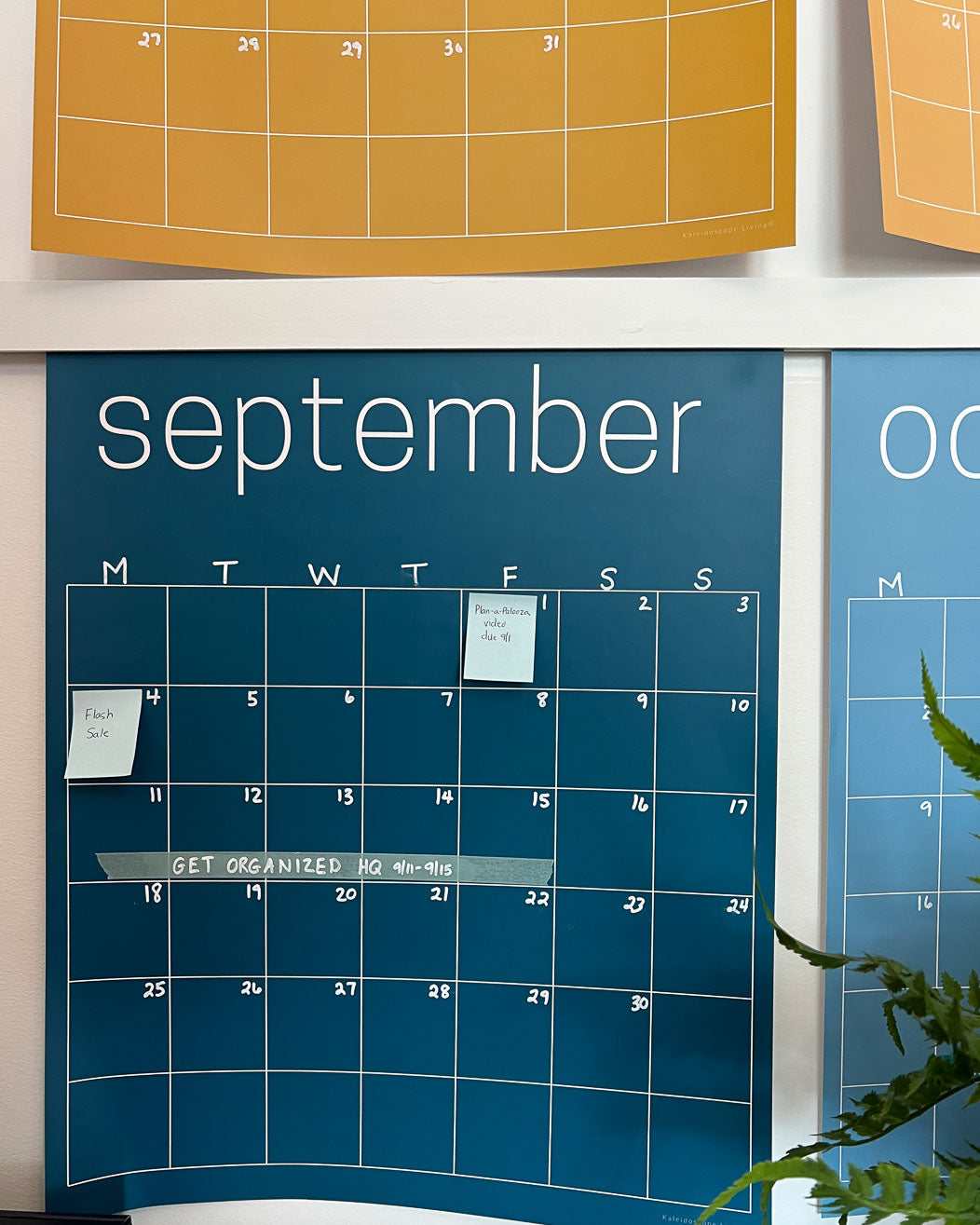 Close up of the September page of the rainbow calendar from Kaleidoscope Living displaying sticky notes and washi tape.