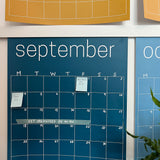 Close up of the September page of the rainbow calendar from Kaleidoscope Living displaying sticky notes and washi tape.