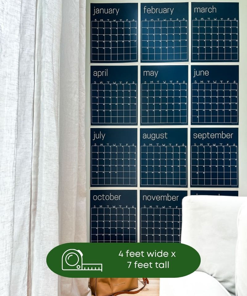 image showing navy blue reusable wall calendar hanging on a wall with text overlay that shows measurement of 4 feet wide by 7 feet tall